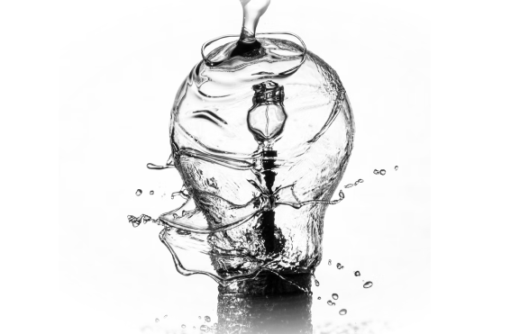 Image of lightbulb with water being poured on it. | GrayCyan